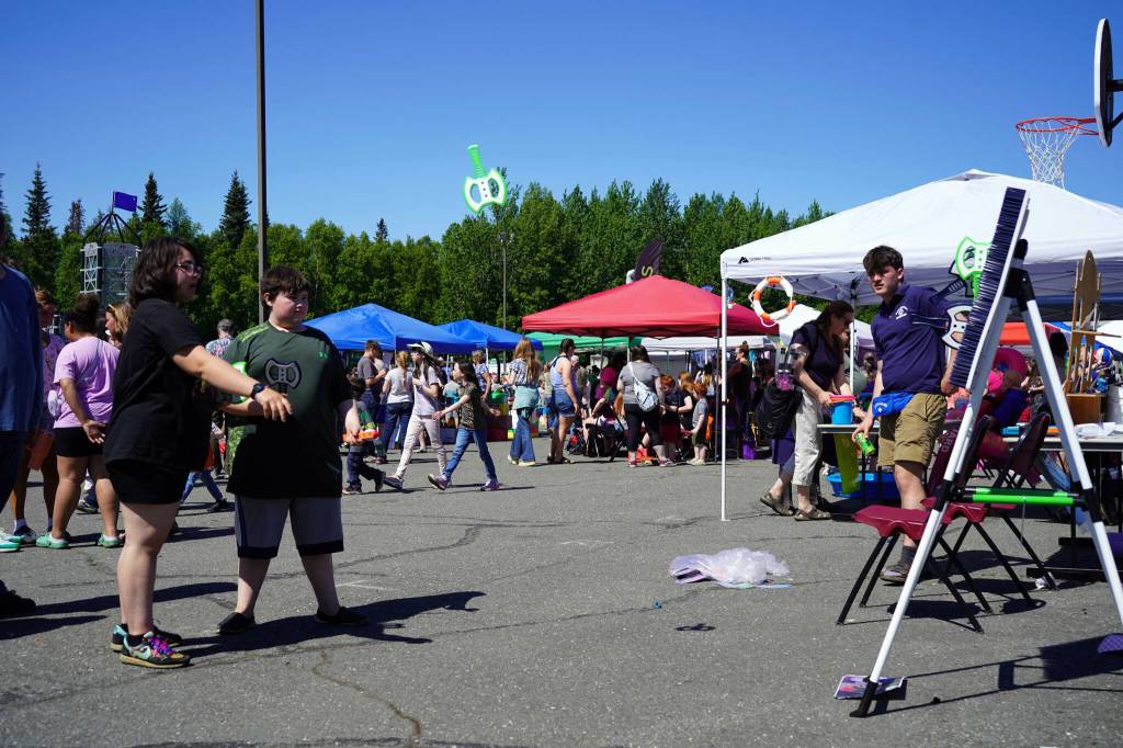 Attendees participate in carnival games during North Peninsula Recreation Service Areas Family Fun in the Midnight Sun at the Nikiski Community Recreation Center in Nikiski, Alaska, on Saturday, June 15, 2024. (Jake Dye/Peninsula Clarion)