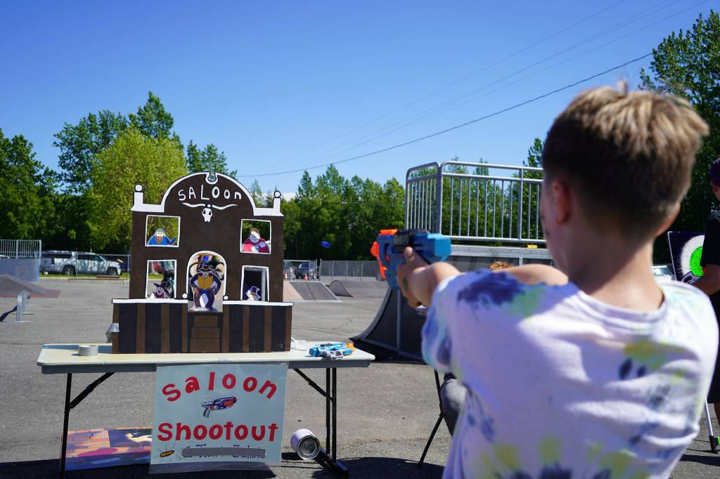 Attendees participate in carnival games during North Peninsula Recreation Service Areas Family Fun in the Midnight Sun at the Nikiski Community Recreation Center in Nikiski, Alaska, on Saturday, June 15, 2024. (Jake Dye/Peninsula Clarion)