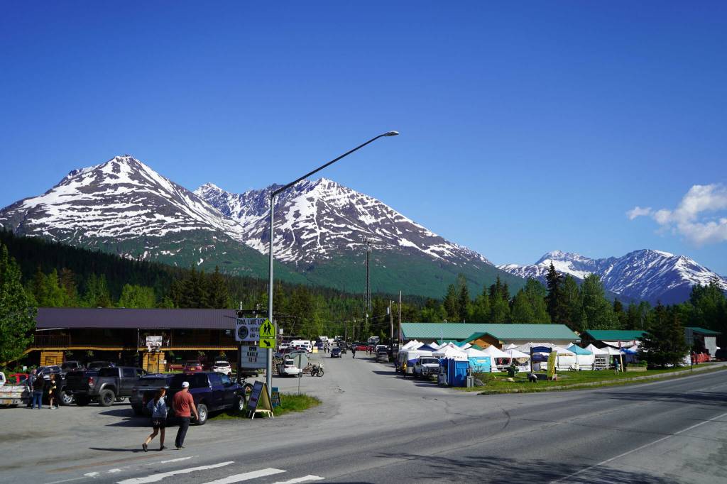 People converge towards the 45th Annual Moose Pass Summer Solstice Festival in Moose Pass, Alaska, on Saturday, June 15, 2024. (Jake Dye/Peninsula Clarion)