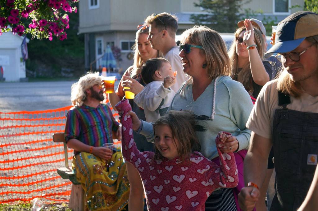 Attendees dance and smile during the 45th Annual Moose Pass Summer Solstice Festival in Moose Pass, Alaska, on Saturday, June 15, 2024. (Jake Dye/Peninsula Clarion)