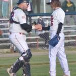 Peninsula Oilers catcher Brock Wirthgen congratulates pitcher Mose Hayes after a victory over the Mat-Su Miners on Tuesday, June 18, 2024, at Coral Seymour Memorial Park in Kenai, Alaska. (Photo by Jeff Helminiak/Peninsula Clarion)