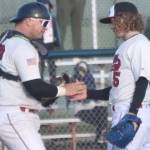 Peninsula Oilers catcher Brock Wirthgen congratulates pitcher Mose Hayes after a victory over the Mat-Su Miners on Tuesday, June 18, 2024, at Coral Seymour Memorial Park in Kenai, Alaska. (Photo by Jeff Helminiak/Peninsula Clarion)