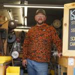 Grey Wilson, of Wilsons Proper Edge, stands for a photo at Soldotna Creek Park in Soldotna, Alaska, on Wednesday, June 19, 2024. (Jake Dye/Peninsula Clarion)