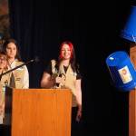 Girl Scout Troop 210, which includes Caitlyn Eskelin, Emma Hindman, Kadie Newkirk and Lyberty Stockman, present their "Bucket Trees" to a panel of judges in the 34th Annual Caring for the Kenai Competition at Kenai Central High School in Kenai, Alaska, on Thursday, April 18, 2024. (Jake Dye/Peninsula Clarion)