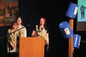 Jake Dye/Peninsula Clarion
Girl Scout Troop 210, which includes Caitlyn Eskelin, Emma Hindman, Kadie Newkirk and Lyberty Stockman, present their Bucket Trees to a panel of judges in the 34th Annual Caring for the Kenai Competition at Kenai Central High School on Thursday, April 18.