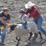 Juniper Bitterich competes in Mutton Bustin on Saturday, June 22, 2024, at the second Soldotna Equestrian Association rodeo of the season at the Soldotna Rodeo Grounds in Soldotna, Alaska. (Photo by Jeff Helminiak/Peninsula Clarion)