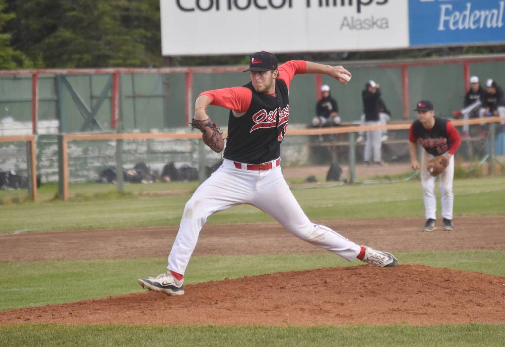 Peninsula Oilers starter Jacob Tabor delivers to the Anchorage Bucs on Thursday, June 27, 2024, at Coral Seymour Memorial Park in Kenai, Alaska. (Photo by Jeff Helminiak/Peninsula Clarion)