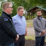 Marathon Kenai refinery General Manager Bruce Jackman, City of Kenai Mayor Brian Gabriel and Kenai Parks and Recreation Director Tyler Best speak at an event celebrating the installation of a new inclusive seesaw at Kenai Municipal Park in Kenai, Alaska, on Thursday, June 27, 2024. (Jake Dye/Peninsula Clarion)