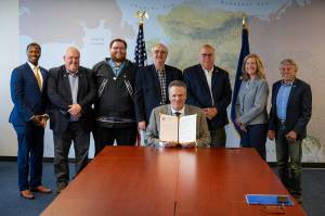 Gov. Mike Dunleavy is pictured with members of the House Majority after signing the fiscal year 2025 budget bills on June 27 in Anchorage. From left to right: Reps. Stanley Wright, Tom McKay, Thomas Baker, Craig Johnson, Kevin McCabe, Julie Coulombe, and Laddie Shaw. (Photo provided by Office of the Governor)