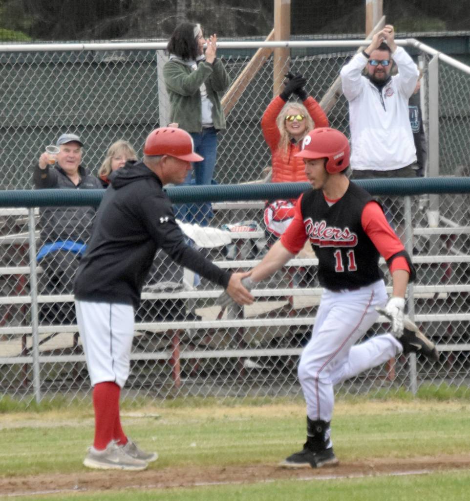 Peninsula Oilers designated hitter Eddie Leon rounds third after a two-run home run against the Anchorage Bucs on Saturday, June 29, 2024, at Coral Seymour Memorial Park in Kenai, Alaska. (Photo by Jeff Helminiak/Peninsula Clarion)