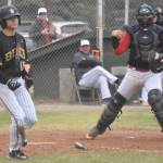 Peninsula Oilers catcher Brock Wirthgen celebrates after tagging out Christian Powell of the Anchorage Bucs for the final out of the game Saturday, June 29, 2024, at Coral Seymour Memorial Park in Kenai, Alaska. (Photo by Jeff Helminiak/Peninsula Clarion)