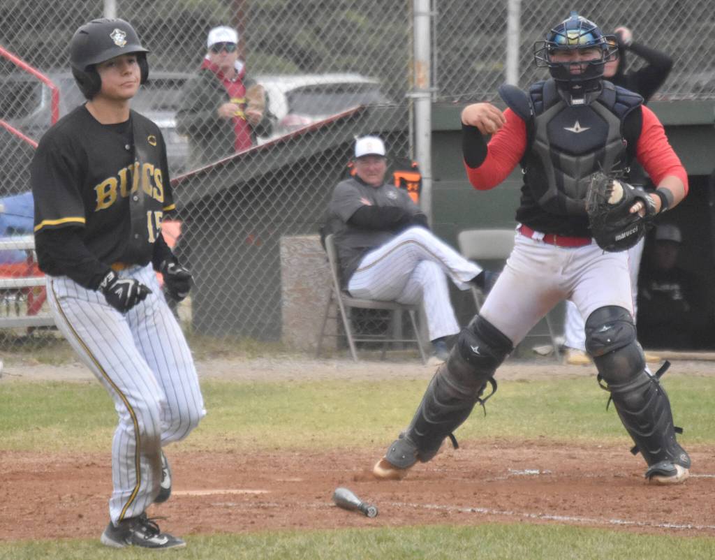 Peninsula Oilers catcher Brock Wirthgen celebrates after tagging out Christian Powell of the Anchorage Bucs for the final out of the game Saturday, June 29, 2024, at Coral Seymour Memorial Park in Kenai, Alaska. (Photo by Jeff Helminiak/Peninsula Clarion)