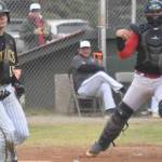 Peninsula Oilers catcher Brock Wirthgen celebrates after tagging out Christian Powell of the Anchorage Bucs for the final out of the game Saturday, June 29, 2024, at Coral Seymour Memorial Park in Kenai, Alaska. (Photo by Jeff Helminiak/Peninsula Clarion)