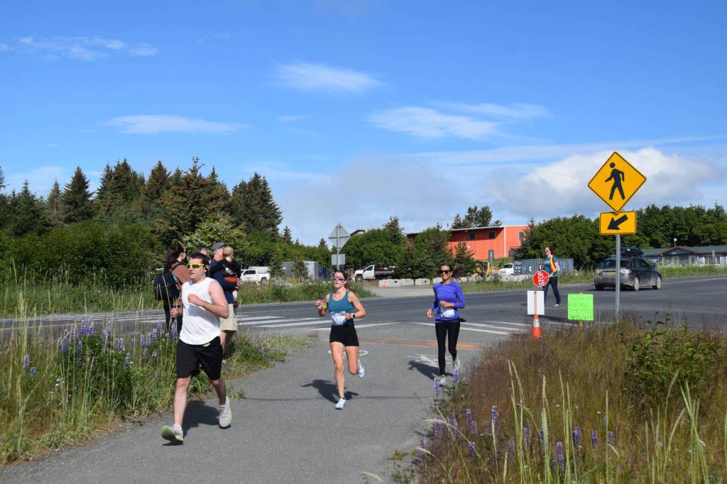 Runners jog down the Homer Spit Trail during the Homer Spit Run 10K to the Bay on Saturday, June 29, 2024, in Homer, Alaska. (Delcenia Cosman/Homer News)