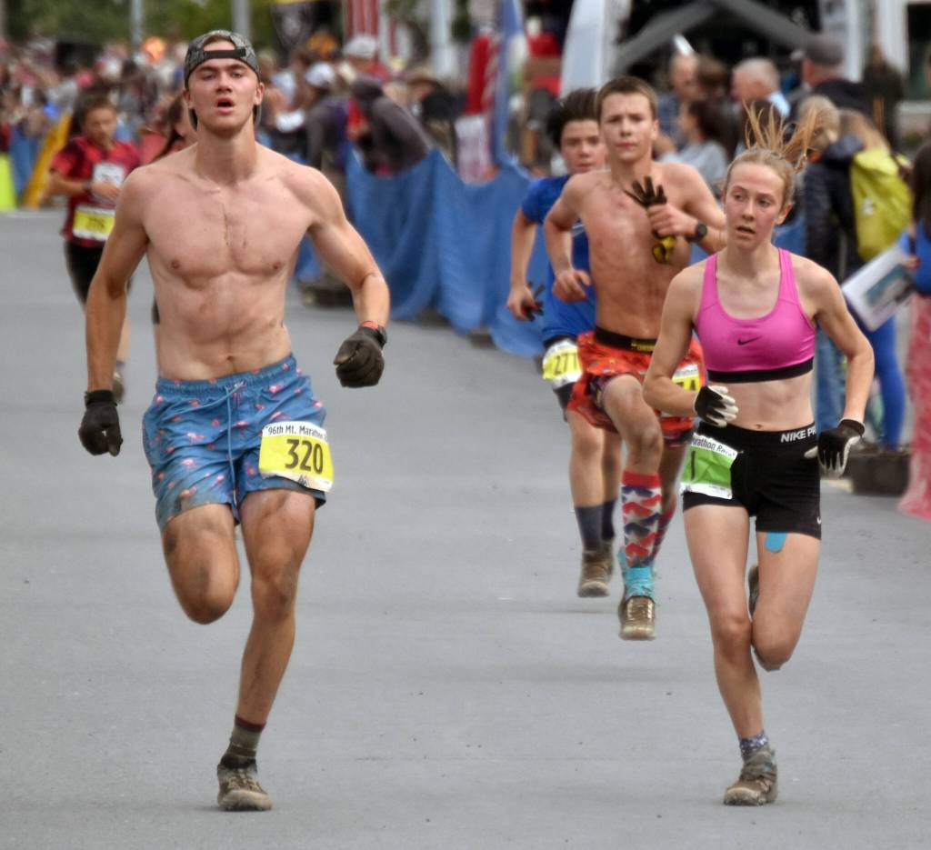 Kenais Tania Boonstra races Esters PJ Bragonier in the junior race at the Mount Marathon Race on Thursday, July 4, 2024, in Seward, Alaska. Boonstra was third in the girls race. (Photo by Jeff Helminiak/Peninsula Clarion)