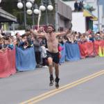James Carlberg, Pyper Dixon and Erik Johnson race for top spots in the mens race at the Mount Marathon Race on Thursday, July 4, 2024, in Seward, Alaska. Carlberg was 16th, Dixon was 17th and Johnson was 18th. (Photo by Jeff Helminiak/Peninsula Clarion)