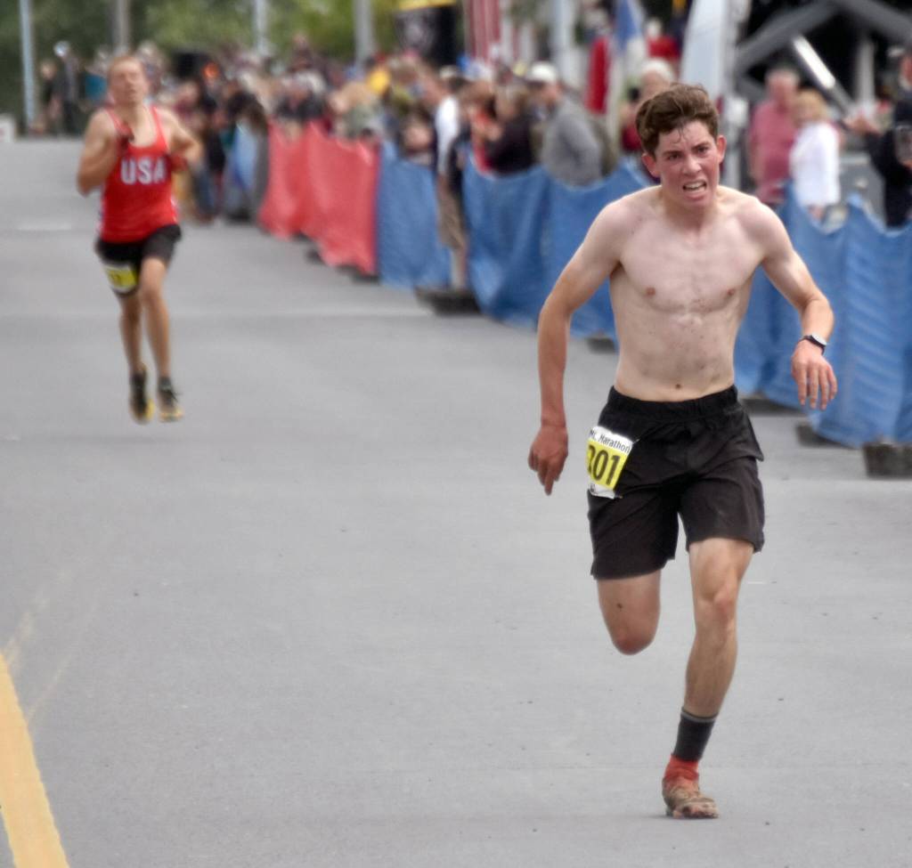 Palmers Coby Marvin outruns Anchorages Vebjorn Flagstad to win his third boys title at the Mount Marathon Race on Thursday, July 4, 2024, in Seward, Alaska. (Photo by Jeff Helminiak/Peninsula Clarion)