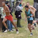 Bodhi Gross and Ali Papillon, both of Manitou Springs, Colorado, approach the mountain in the mens race at the Mount Marathon Race on Thursday, July 4, 2024, in Seward, Alaska. (Photo by Jeff Helminiak/Peninsula Clarion)