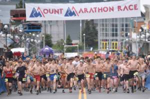 The junior race starts Thursday, July 4, 2024, at the Mount Marathon Race in Seward, Alaska. (Photo by Jeff Helminiak/Peninsula Clarion)