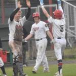 Post 20 Twins catcher Jayden Stuyvesant congratulates Malakai Olson on the game-winning hit Saturday, July 6, 2024, at Coral Seymour Memorial Park in Kenai, Alaska. (Photo by Jeff Helminiak/Peninsula Clarion)