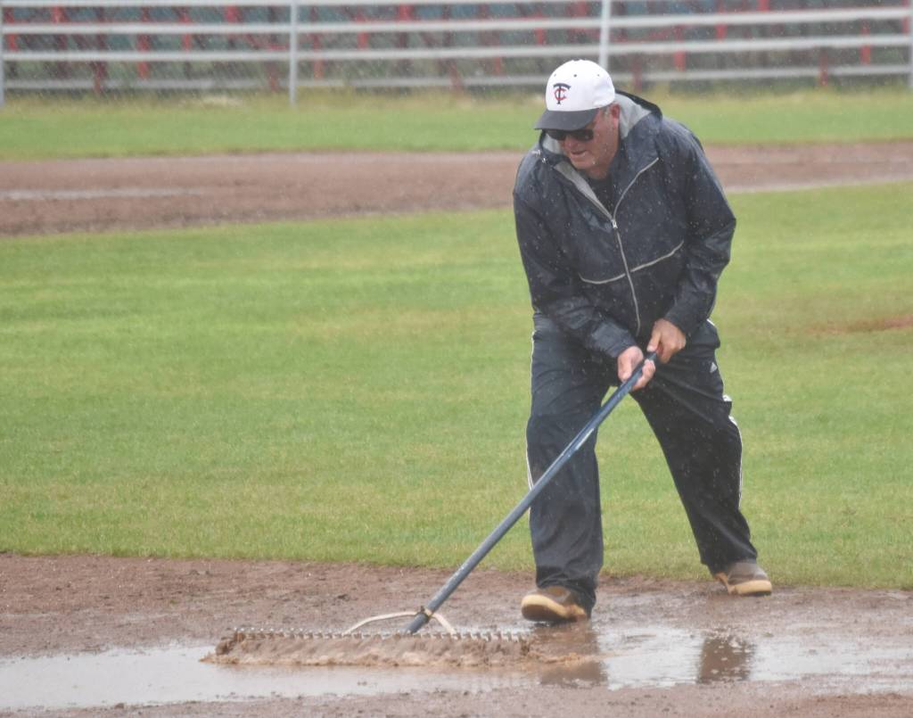 Post 20 Twins coach Robb Quelland works the field between innings Saturday, July 6, 2024, at Coral Seymour Memorial Park in Kenai, Alaska. (Photo by Jeff Helminiak/Peninsula Clarion)