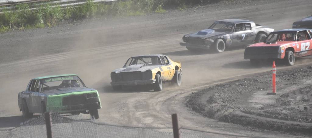 Keven Powers rounds Turn 4 ahead of Regan Savely in A Stock Heat 2 on Sunday, July 7, 2024, at the Skylar Thomas Memorial at Twin City Raceway in Kenai, Alaska. (Photo by Jeff Helminiak/Peninsula Clarion)