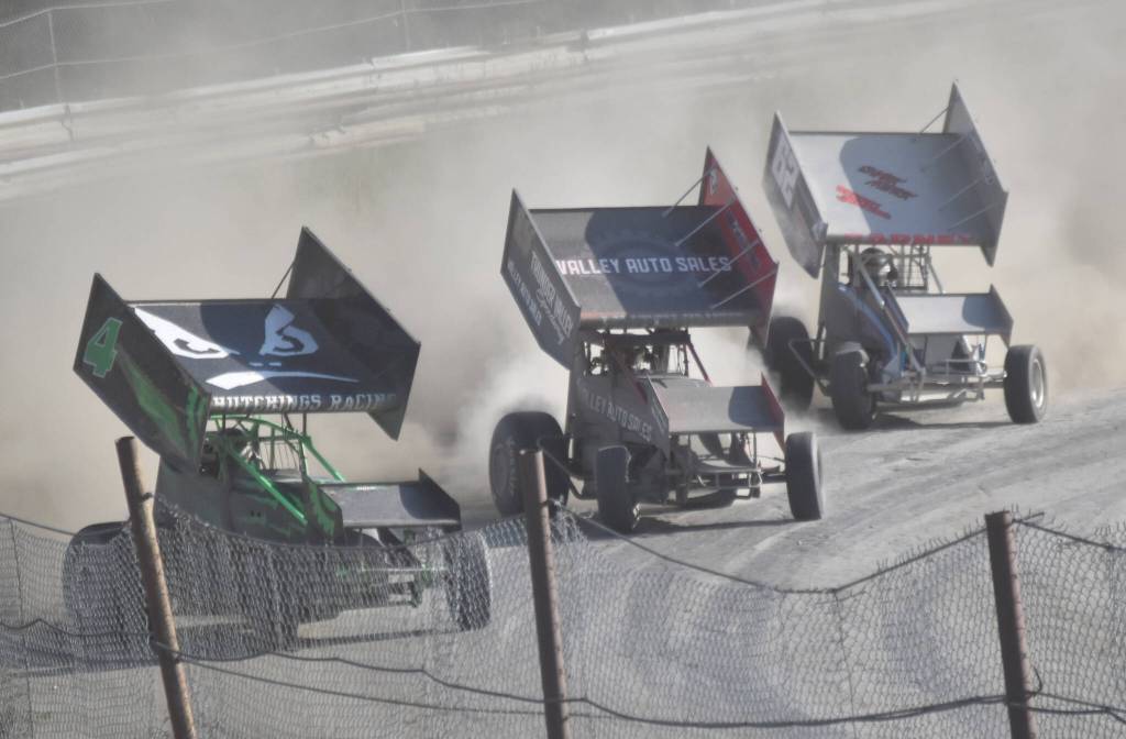 Jason Hutchings, Philip Hutchings and Clifford Barney rip around Turn 4 in Sprints Heat 2 on Sunday, July 7, 2024, in the Skylar Thomas Lyon Memorial at Twin City Raceway in Kenai, Alaska. Jason Hutchings was first, Barney was third and Philip Hutchings did not finish. (Photo by Jeff Helminiak/Peninsula Clarion)
