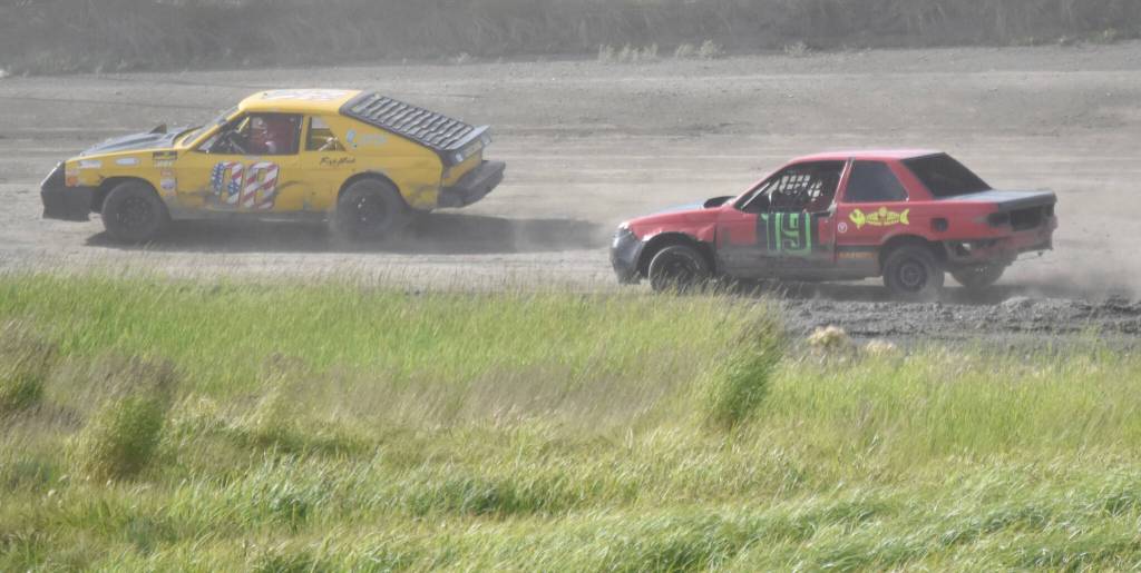 Carl Liebes holds off Jonathan Voight for victory in Mini Stock Heat 1 on Sunday, July 7, 2024, in the Skylar Thomas Lyon Memorial at Twin City Raceway in Kenai, Alaska. (Photo by Jeff Helminiak/Peninsula Clarion)