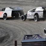 Cole Petersen leads Dustin Bass and Alex Clevenger in Modified Heat 2 on Sunday, July 7, 2024, in the Skylar Thomas Lyon Memorial at Twin City Raceway in Kenai, Alaska. Petersen won, while Bass was second and Clevenger was third. (Photo by Jeff Helminiak/Peninsula Clarion)