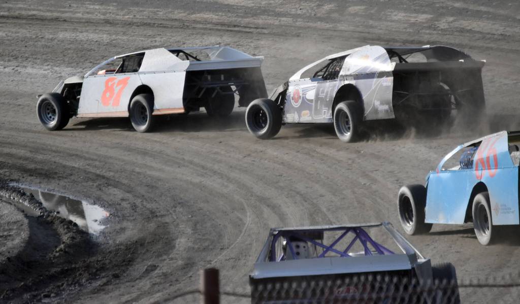 Cole Petersen leads Dustin Bass and Alex Clevenger in Modified Heat 2 on Sunday, July 7, 2024, in the Skylar Thomas Lyon Memorial at Twin City Raceway in Kenai, Alaska. Petersen won, while Bass was second and Clevenger was third. (Photo by Jeff Helminiak/Peninsula Clarion)