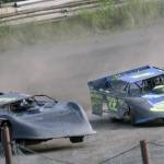 Jesse Wilson and Alex Schwochert both have front tires off the ground as they swing around Turn 4 in Late Model Heat 2 on Sunday, July 7, 2024, in the Skylar Thomas Lyon Memorial at Twin City Raceway in Kenai, Alaska. Wilson was first, while Schwochert was second. (Photo by Jeff Helminiak/Peninsula Clarion)