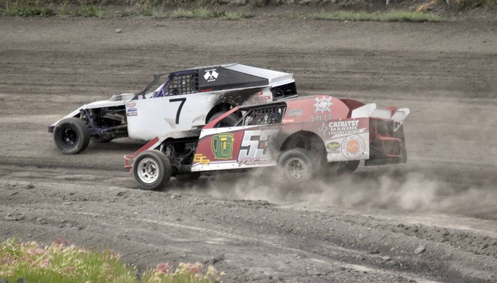 Jesse Yancy and Clay Petersen race around Turn 2 in Modified Heat 1 on Sunday, July 7, 2024, in the Skylar Thomas Lyon Memorial at Twin City Raceway in Kenai, Alaska. Yancy was second while Petersen was fifth. (Photo by Jeff Helminiak/Peninsula Clarion)