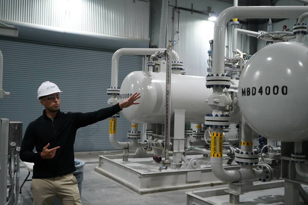 Furie Operations Superintendent Ben Christianson shows off natural gas processing equipment at Furie Operating Alaskas central processing facility in Nikiski, Alaska, on Wednesday, July 10, 2024. (Jake Dye/Peninsula Clarion)