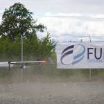 A drone lands while kicking up dust, returning from the test flight for the use of beyond visual line of sight drone aircraft, at Furie Operating Alaskas central processing facility in Nikiski, Alaska, on Wednesday, July 10, 2024. (Jake Dye/Peninsula Clarion)
