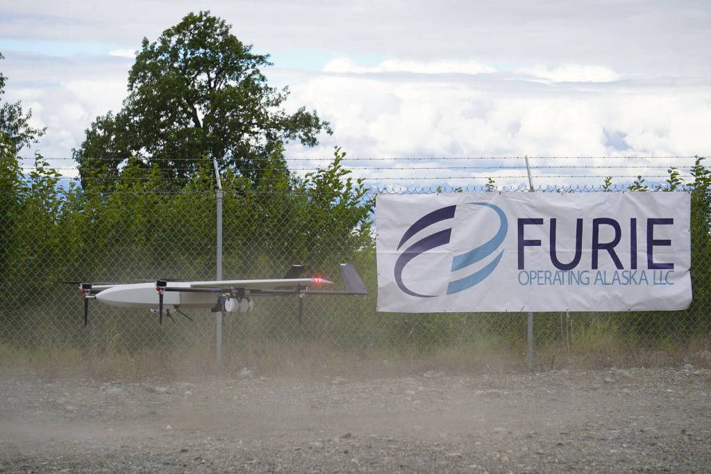 A drone lands while kicking up dust, returning from the test flight for the use of beyond visual line of sight drone aircraft, at Furie Operating Alaskas central processing facility in Nikiski, Alaska, on Wednesday, July 10, 2024. (Jake Dye/Peninsula Clarion)