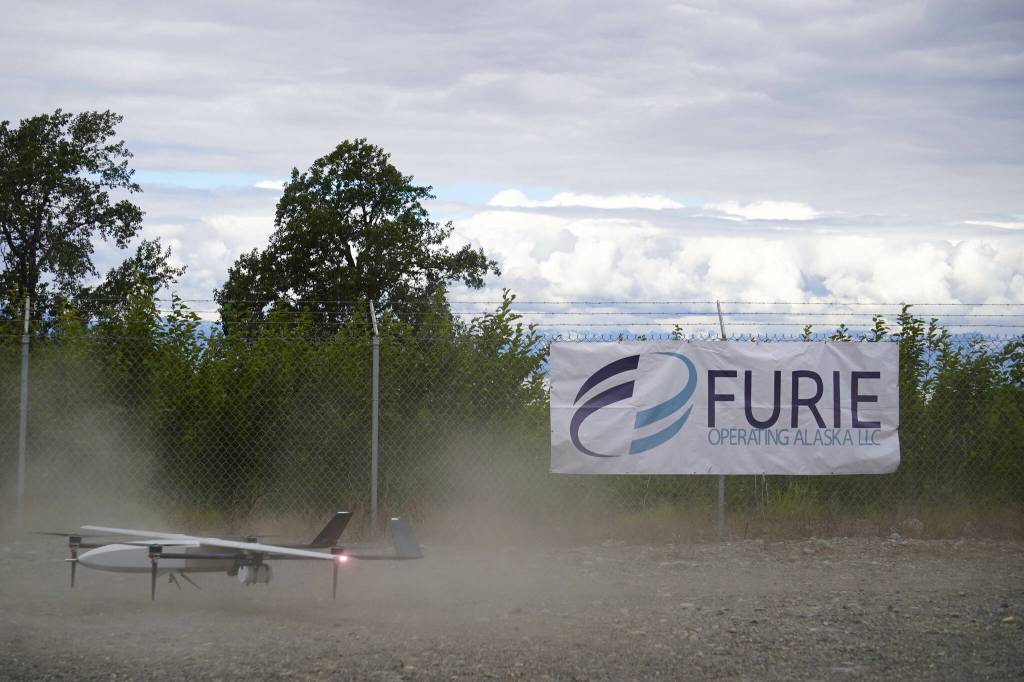 A drone lands while kicking up dust, returning from the test flight for the use of beyond visual line of sight drone aircraft, at Furie Operating Alaskas central processing facility in Nikiski, Alaska, on Wednesday, July 10, 2024. (Jake Dye/Peninsula Clarion)