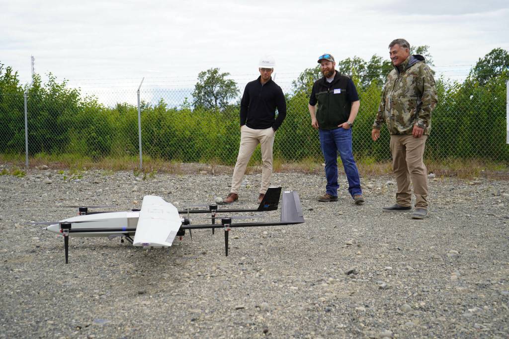 Furie Operations Superintendent Ben Christianson, Furie Operations Engineer Hunter Van Wyhe and HEX President and CEO John Hendrix celebrate a successful test of a drone that flies beyond visual line of sight at Furies central processing facility in Nikiski, Alaska, on Wednesday, July 10, 2024. (Jake Dye/Peninsula Clarion)