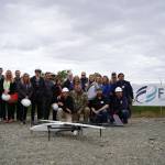 Attendees celebrate a successful test of a drone that flies beyond visual line of sight at Furies central processing facility in Nikiski, Alaska, on Wednesday, July 10, 2024. (Jake Dye/Peninsula Clarion)