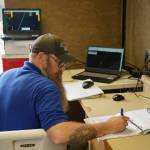 Jason Williams operates a test of a drone that flies beyond visual line of sight at Furies central processing facility in Nikiski, Alaska, on Wednesday, July 10, 2024. Williams was one of two pilots who ran the drone at either end of its route, passing off control in the middle, but the drone largely followed its flight path via autopilot. (Jake Dye/Peninsula Clarion)