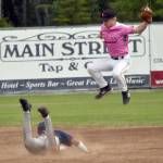 Jayden Hill of the Chugiak-Eagle River Chinooks slides under Peninsula Oilers second baseman Cole Dawson for a stolen base Thursday, July 11, 2024, at Coral Seymour Memorial Park in Kenai, Alaska. (Photo by Jeff Helminiak/Peninsula Clarion)
