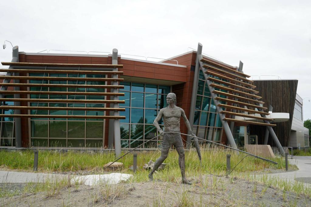 A statue by Joel Isaak stands in front of the Denaina Wellness Center in Kenai, Alaska, on Friday, July 12, 2024. (Jake Dye/Peninsula Clarion)