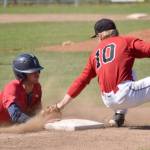 Louis Zulaica of the Chugiak-Eagle River Chinooks steals third under the tag of Cole Dawson of the Oilers during the first game of a doubleheader Sunday, July 14, 2024, at Coral Seymour Memorial Park in Kenai, Alaska. (Photo by Jeff Helminiak/Peninsula Clarion)