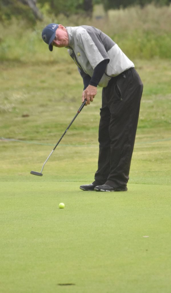 Bill Engberg putts on the No. 3 green at the State Farm Agent Heith Groth Pro Am and Skins Game on Monday, July 15, 2024, at Birch Ridge Golf Course in Soldotna, Alaska. (Photo by Jeff Helminiak/Peninsula Clarion)