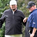 Beau Forrest congratulates George Collum after Collum rolled in a putt on No. 4 for a skin at the State Farm Agent Heith Groth Pro Am and Skins Game on Monday, July 15, 2024, at Birch Ridge Golf Course in Soldotna, Alaska. (Photo by Jeff Helminiak/Peninsula Clarion)