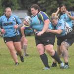 Sara Tinks Kolpack and Sabrina Bukvich of Scylla Rugby try to slow down Meredith Harber of the Kenai River SheWolves at the Kenai Dipnet Fest Rugby 10s Tournament on Saturday, July 13, 2024, in Kenai, Alaska. (Photo by Jeff Helminiak/Peninsula Clarion)