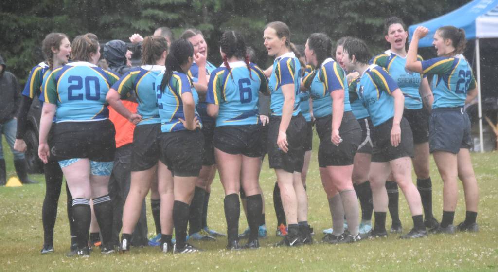 The Kenai River SheWolves get together after a match at the Kenai Dipnet Fest Rugby 10s Tournament on Saturday, July 13, 2024, in Kenai, Alaska. (Photo by Jeff Helminiak/Peninsula Clarion)