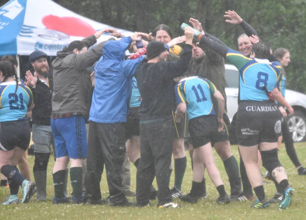 The Kenai River Wolfpack congratulate the Kenai River SheWolves after a match at the Kenai Dipnet Fest Rugby 10s Tournament on Saturday, July 13, 2024, in Kenai, Alaska. (Photo by Jeff Helminiak/Peninsula Clarion)