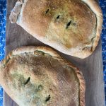 Calzones stuffed with arugula pesto and cheese make for a fun summer meal. (Photo by Tressa Dale/Peninsula Clarion)