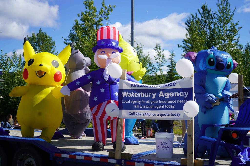 Pikachu, Uncle Sam, Stitch and others ride a float for Allstate Insurances Waterbury Agency with the 67th Annual Soldotna Progress Days Parade down Binkley Street in Soldotna, Alaska, on Saturday, July 27, 2024. (Jake Dye/Peninsula Clarion)