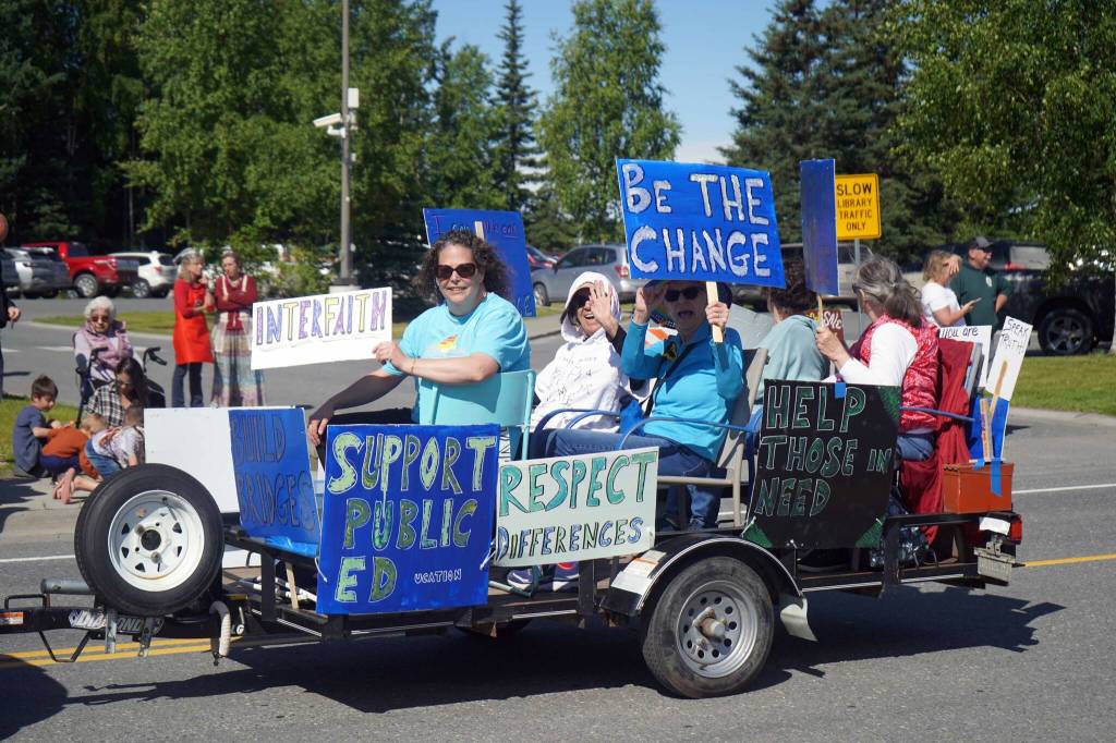A float calling for collaboration rolls with the 67th Annual Soldotna Progress Days Parade down Binkley Street in Soldotna, Alaska, on Saturday, July 27, 2024. (Jake Dye/Peninsula Clarion)